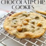 A single chocolate chip cookie on a wire rack.