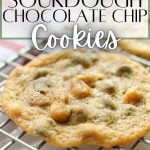 A single chocolate chip cookie on a wire rack.