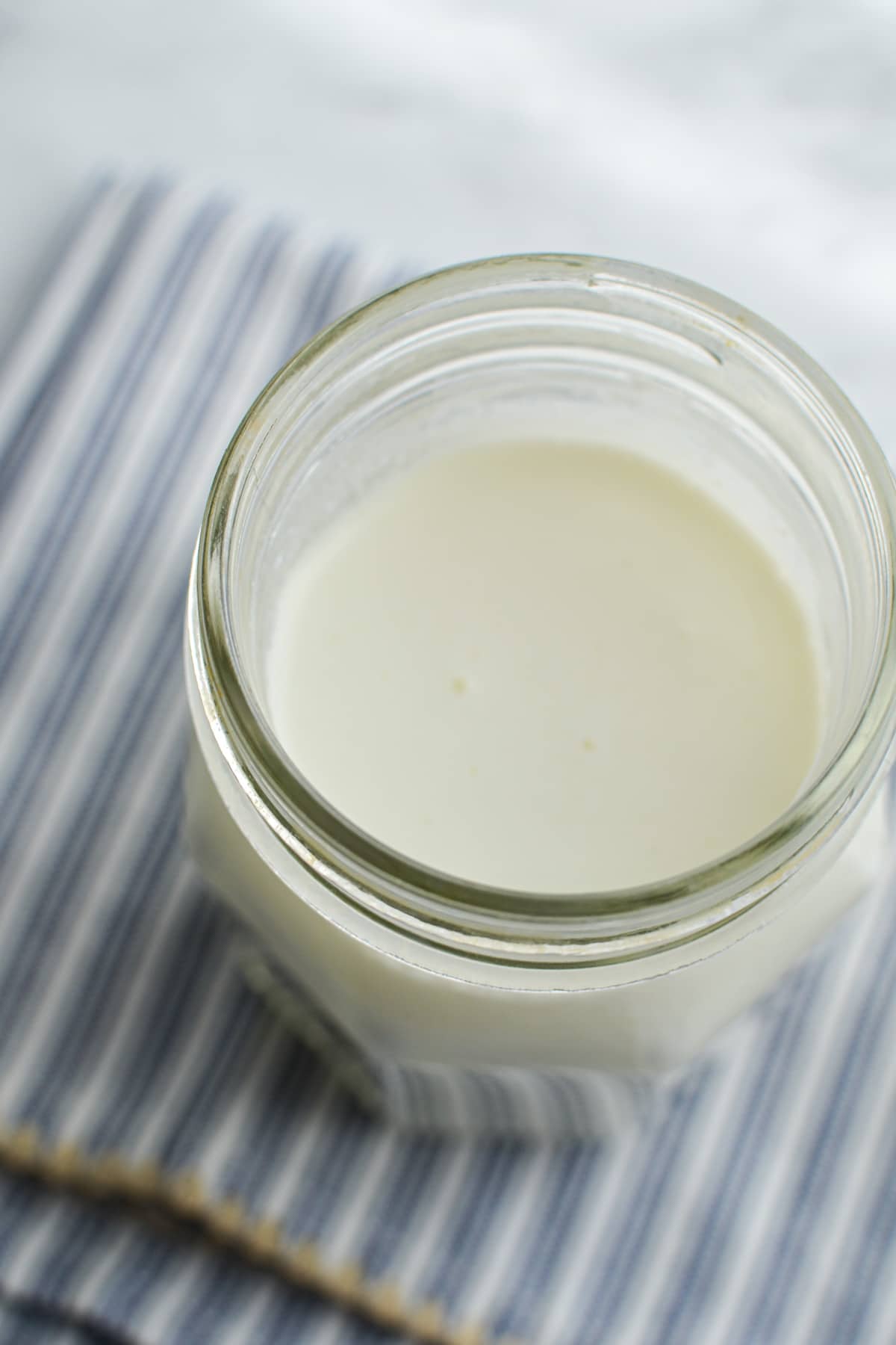 A small jar of goats milk kefir.