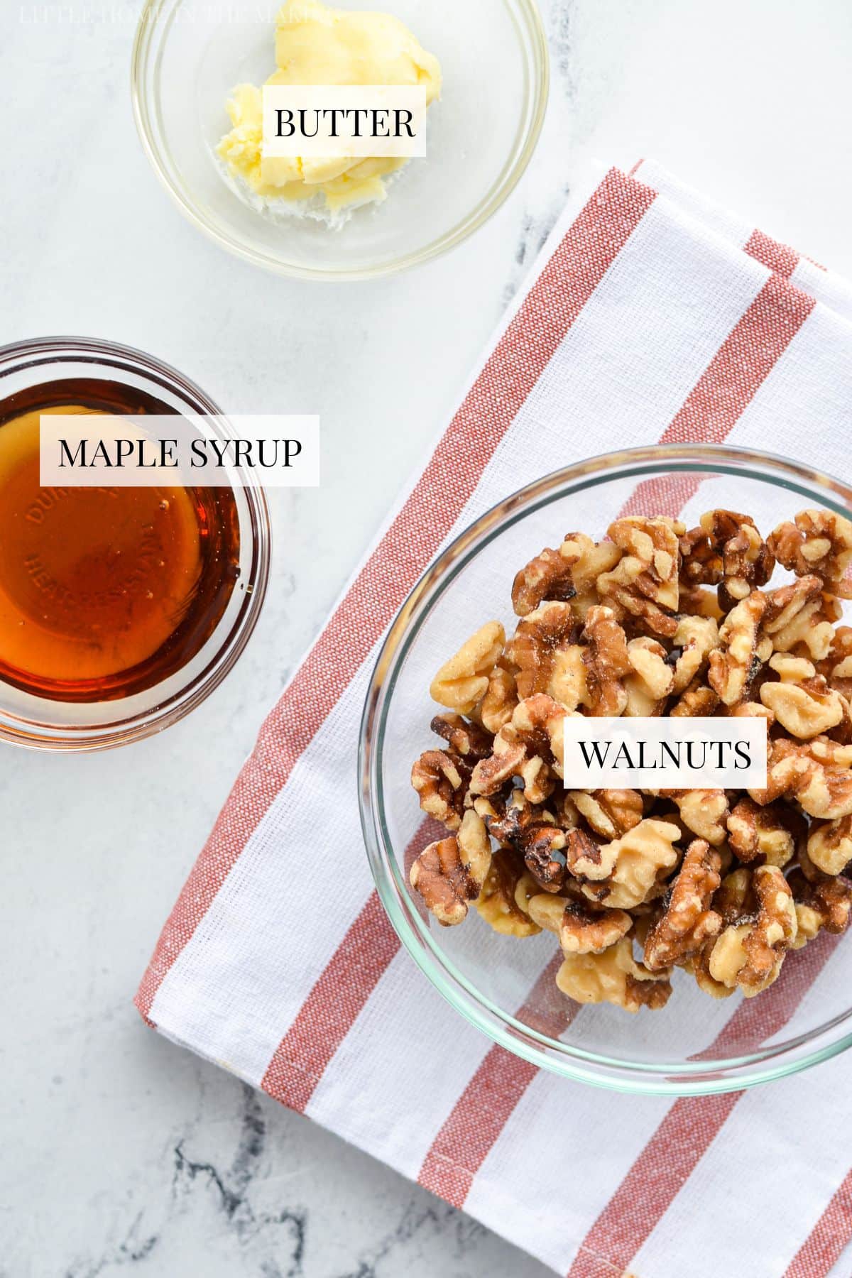 The ingredients needed to make candied walnuts, including walnuts, maple syrup, and butter.