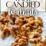 Candied walnuts sprinkled on a piece of parchment.