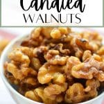 A small white bowl of overflowing candied walnuts.