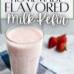 A tall glass of strawberry kefir with strawberries in the background.