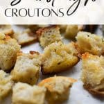 A close up of a sheet pan of sourdough croutons.