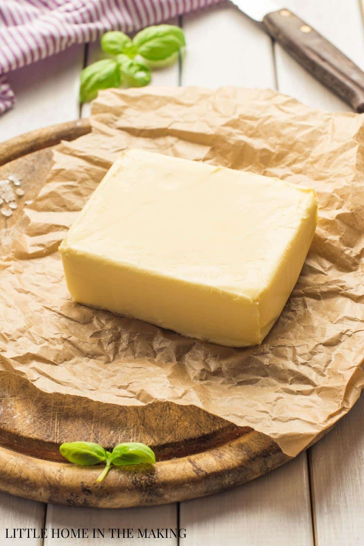 A block of butter on a piece of butcher paper.