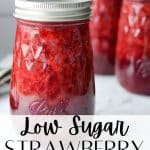 Jars of homemade strawberry jam on a white background.