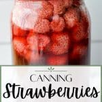 A large jar of whole strawberries canned in syrup.