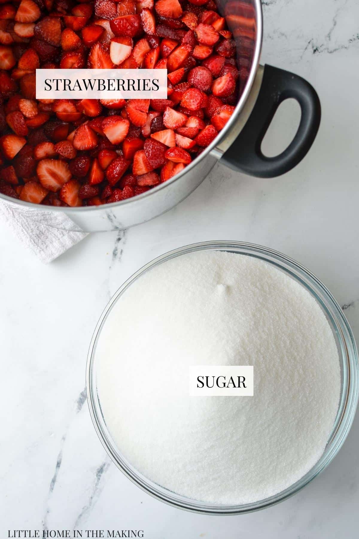 The ingredients needed to make strawberry jam.