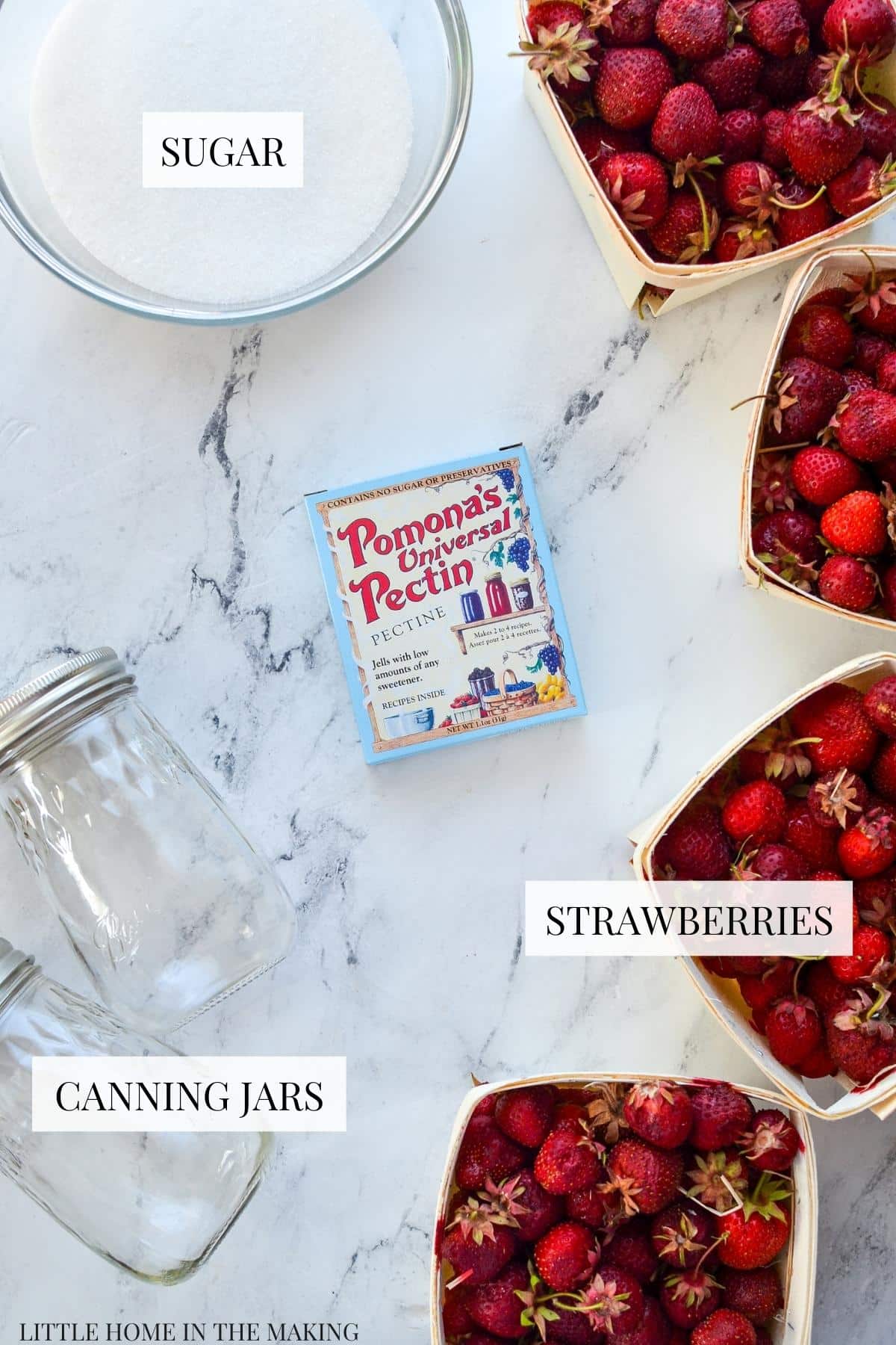 The ingredients needed to make low sugar strawberry jam: strawberries, sugar, and universal pectin.