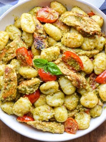 An overhead view of a plate of pesto chicken gnocchi.