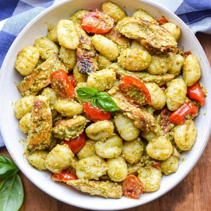 An overhead view of a plate of pesto chicken gnocchi.