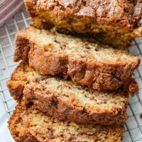 A close up of slices of a quick bread swirled with cinnamon.