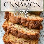 Slices of cinnamon bread fanned onto a wire rack.