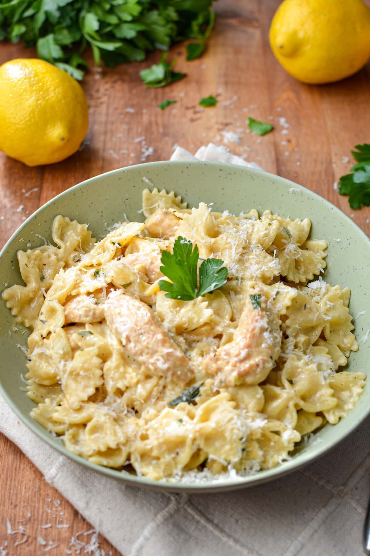 A bowl of farfalle pasta with a creamy sauce.