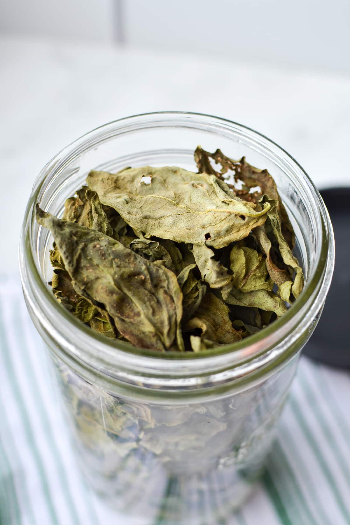 A jar of dried basil.