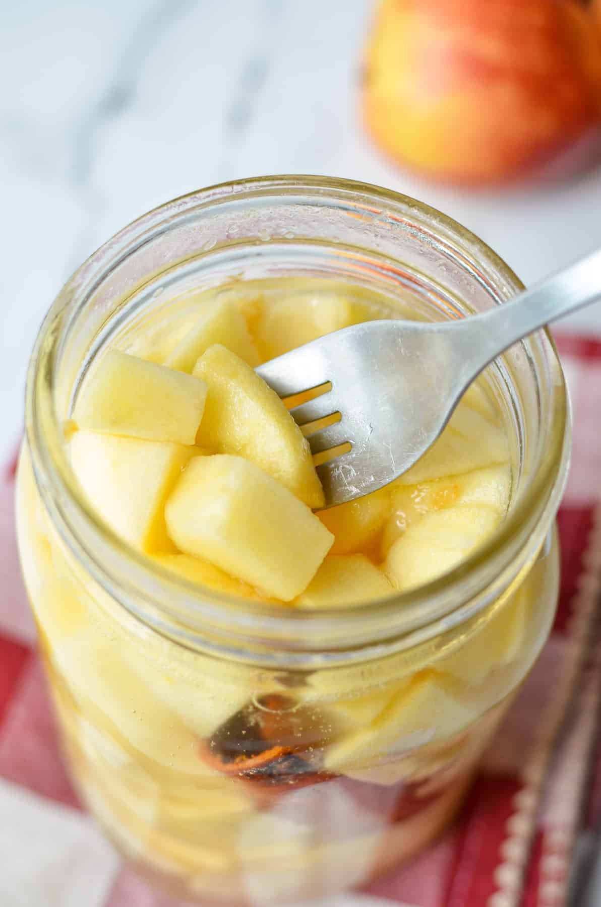 A jar of apples that have been lacto fermented.