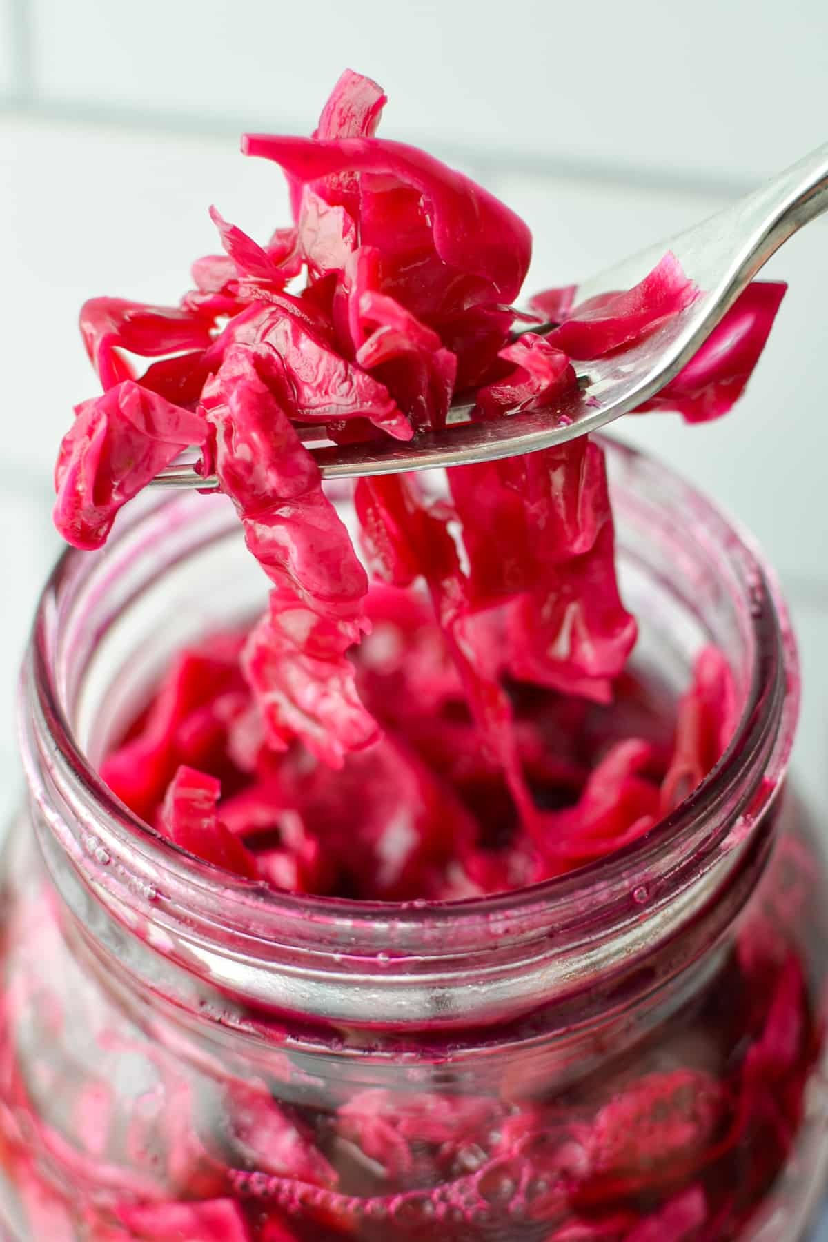 Shredded cabbage that is pink or red in color.