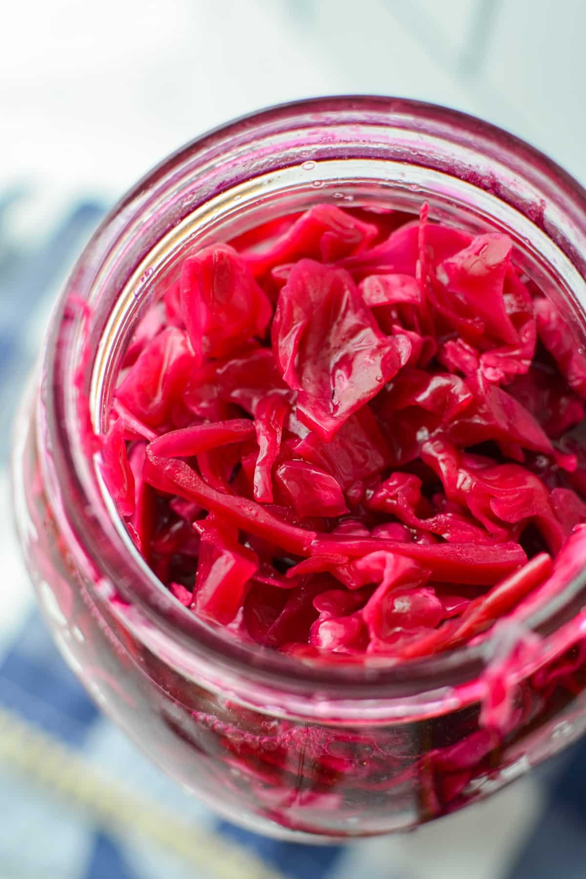 A jar filled with shredded sauerkraut.