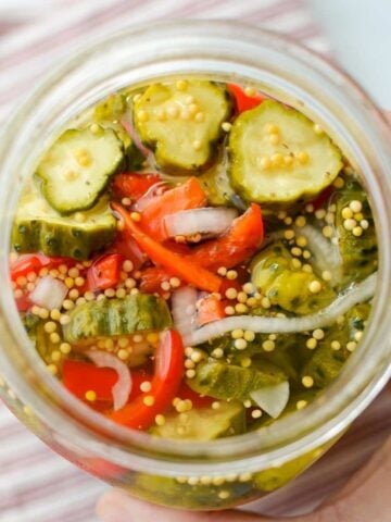 An overhead view of a jar of refrigerator pickles.