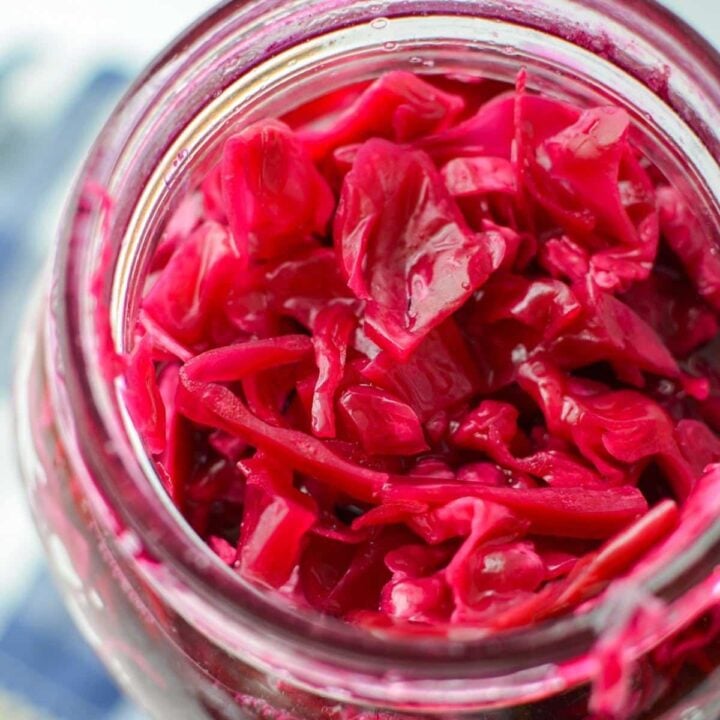 A jar with fermented red cabbage (sauerkraut) inside.