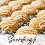 A wire rack filled with pumpkin cookies.