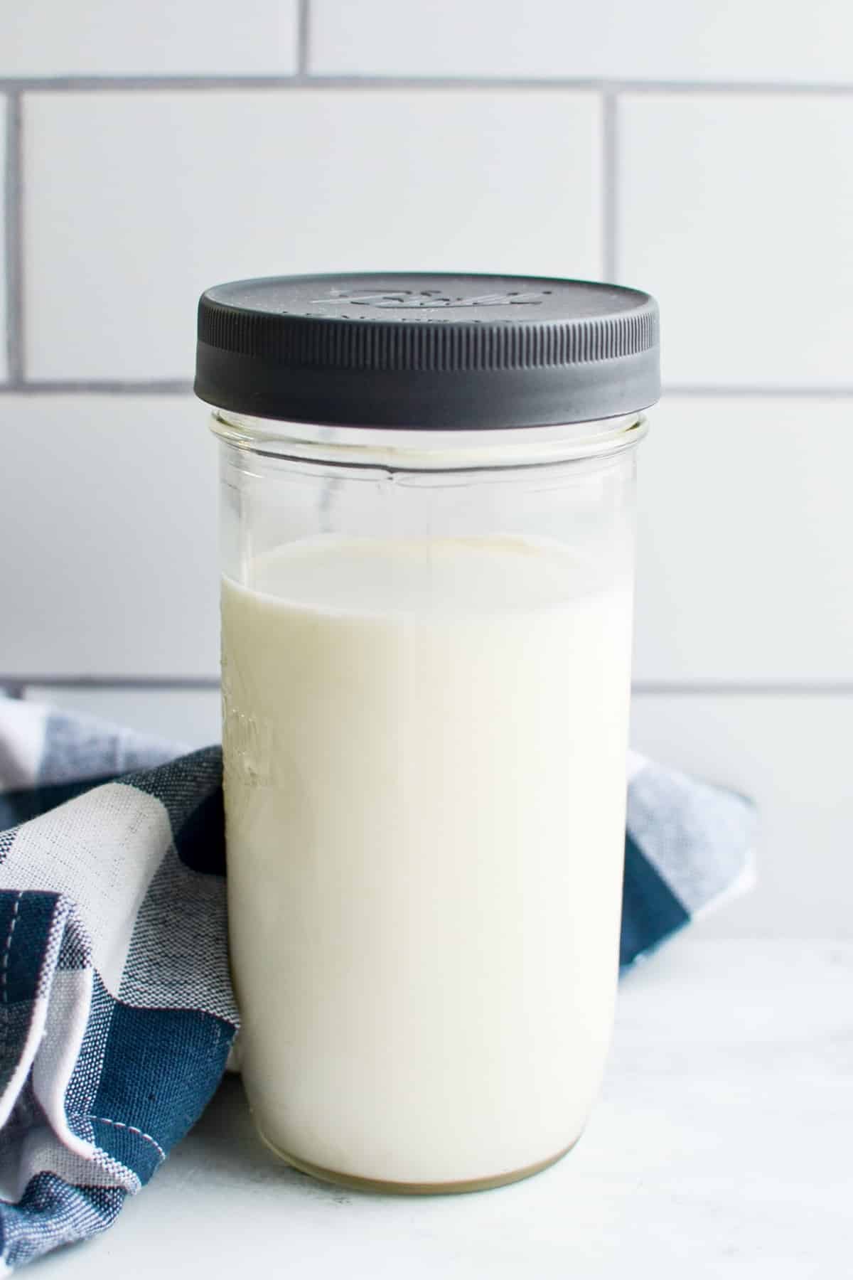 A jar of milk culturing in a jar with an added culture.