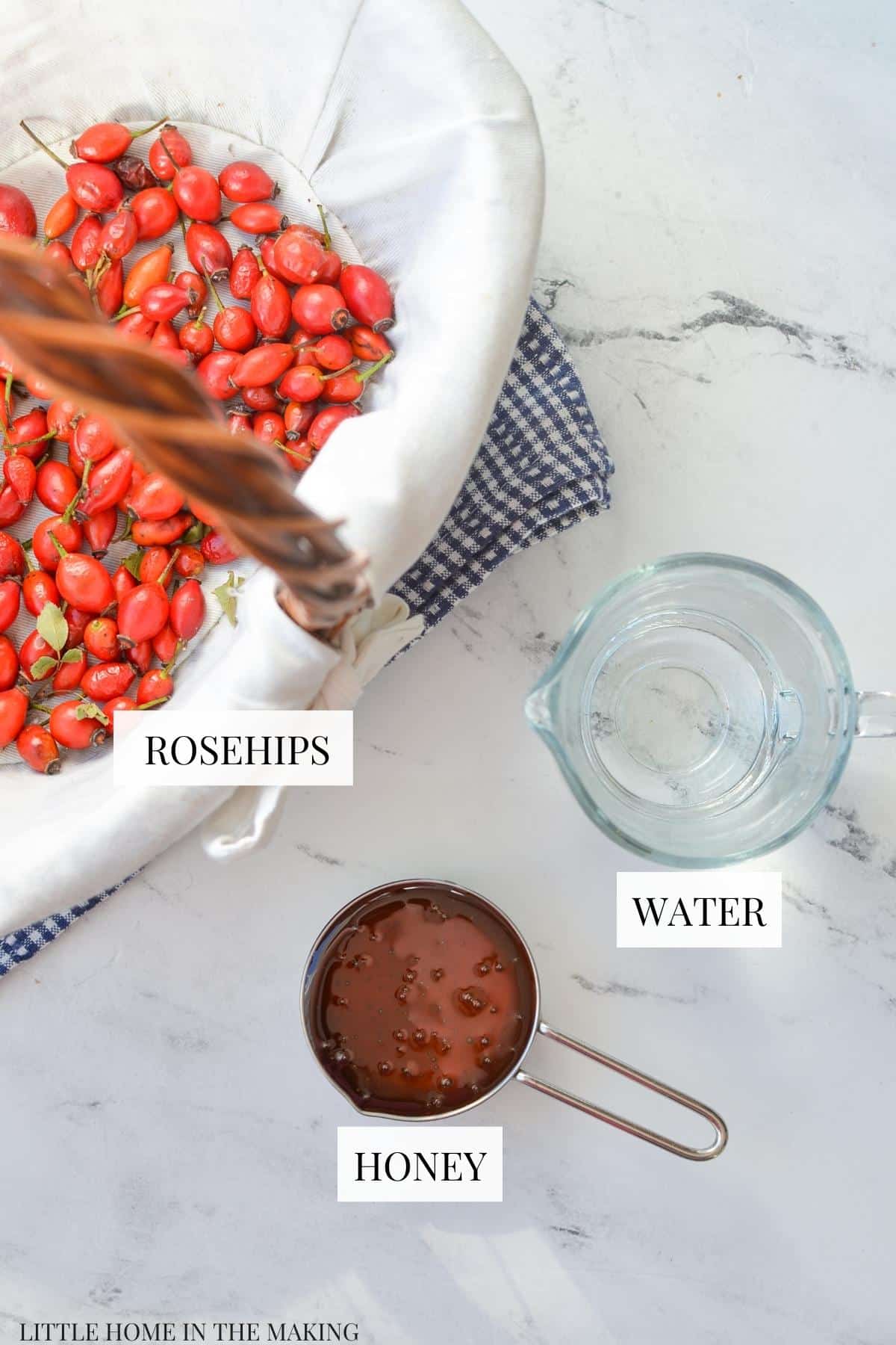 A basket of rosehips, some water, and some honey.