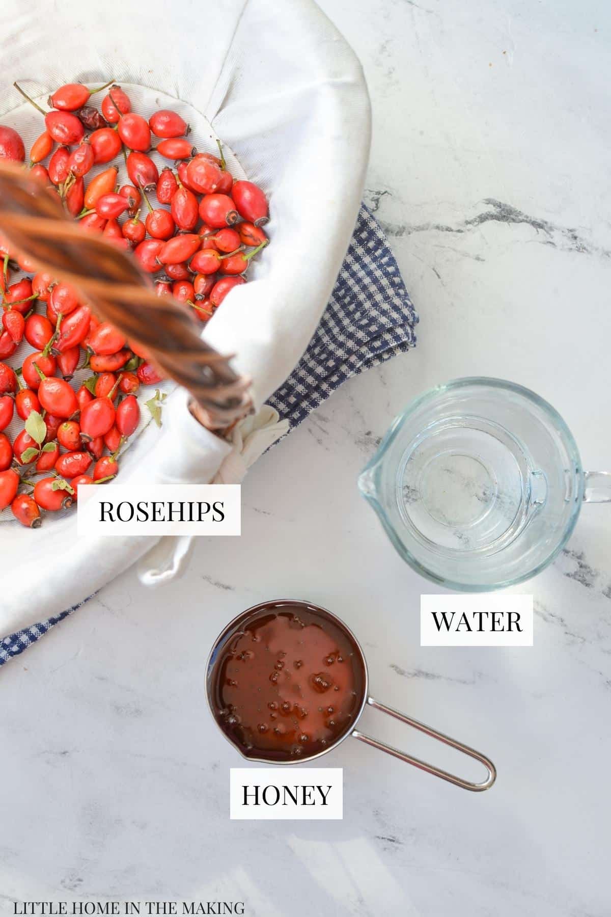 A basket of rosehips, some water, and some honey.
