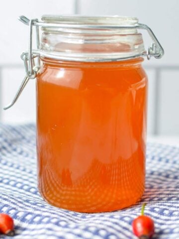 A small jar of rosehip syrup.