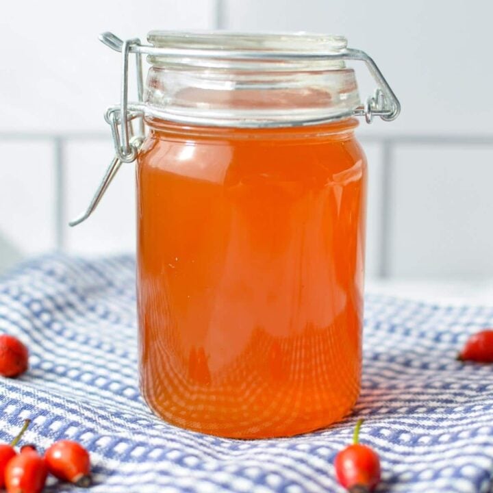 A small jar of rosehip syrup.
