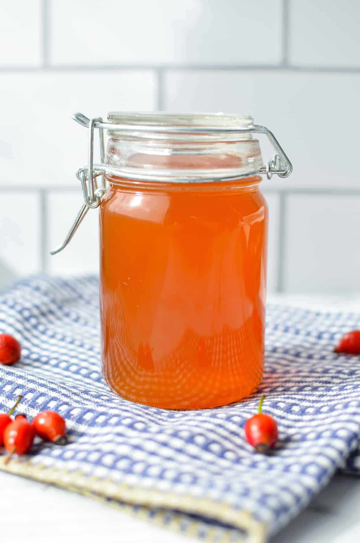 A small jar of rosehip syrup.