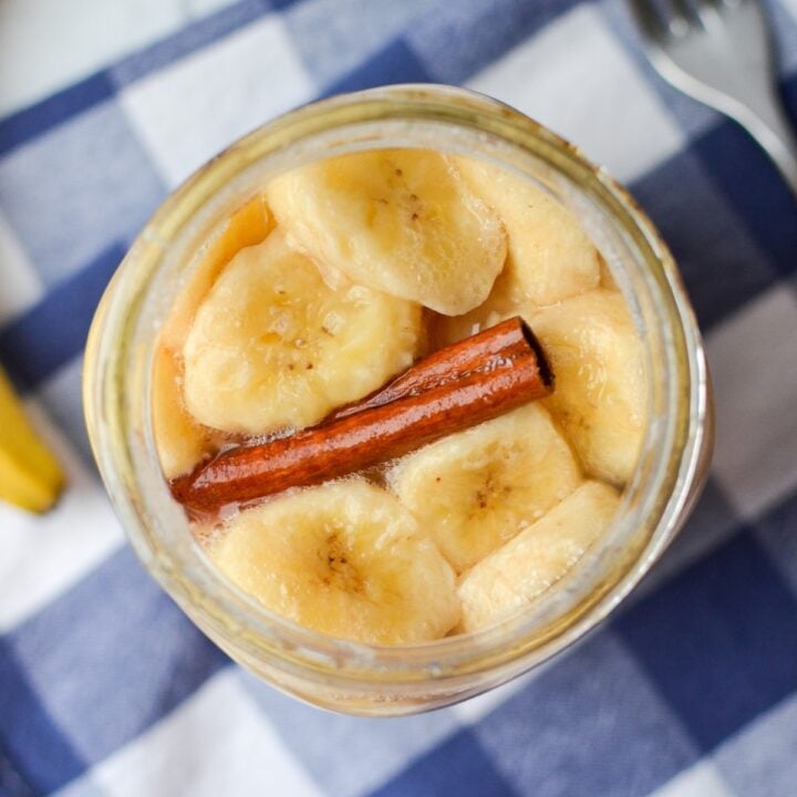 A jar of sliced bananas with cinnamon.