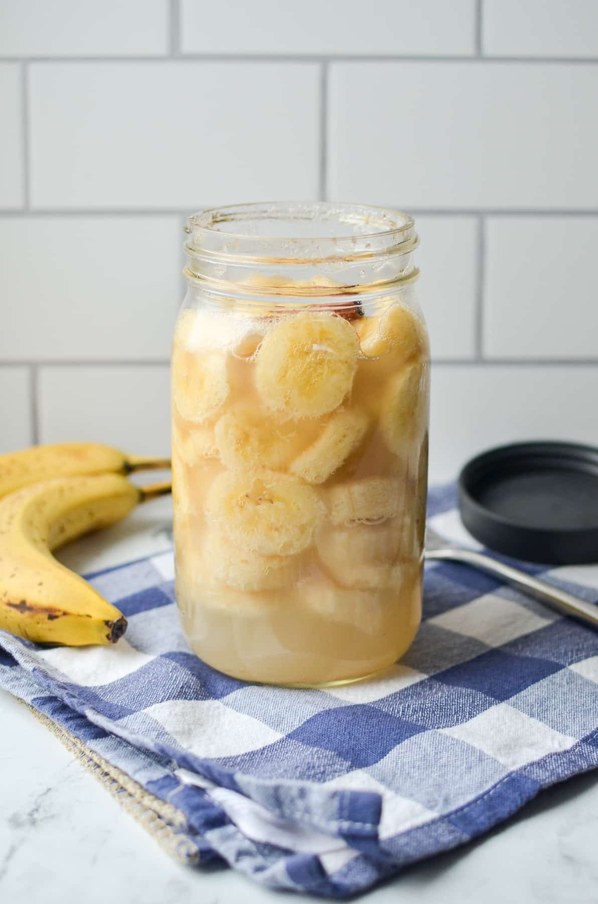 A jar of bananas that have been fermented.