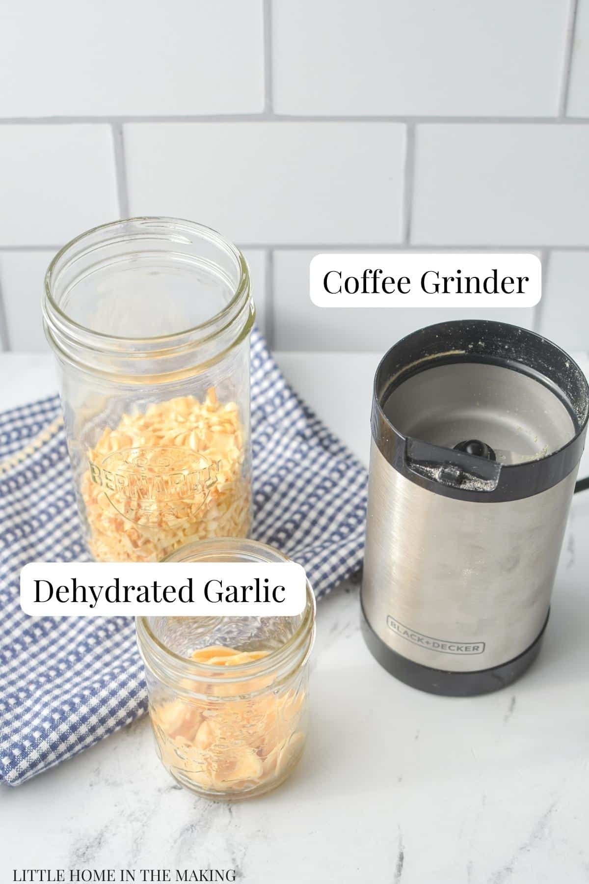 Jars of dried garlic and a coffee grinder.