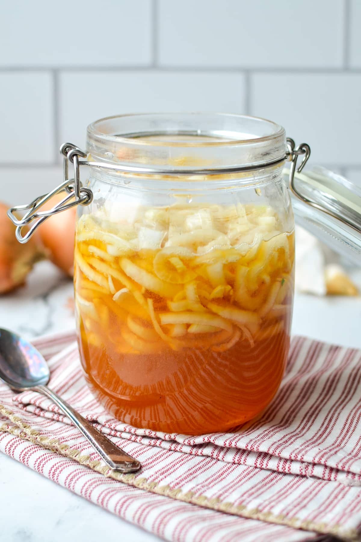 A jar of honey infused with softened onions.