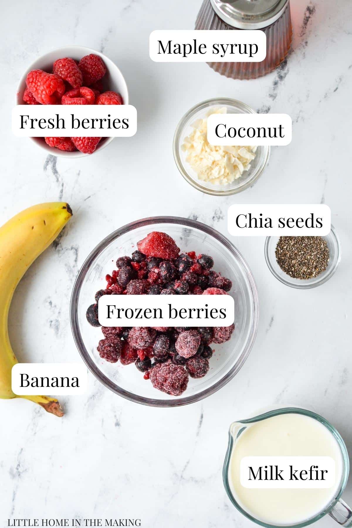 The ingredients needed to make a smoothie bowl: frozen fruit, kefir, chia, bananas, etc.