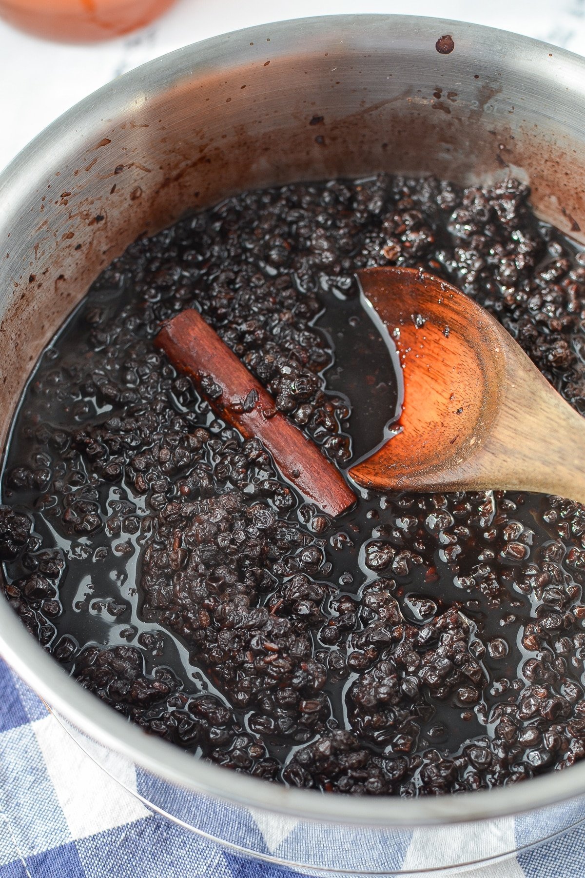 Elderberries that have been simmering with water and cinnamon.