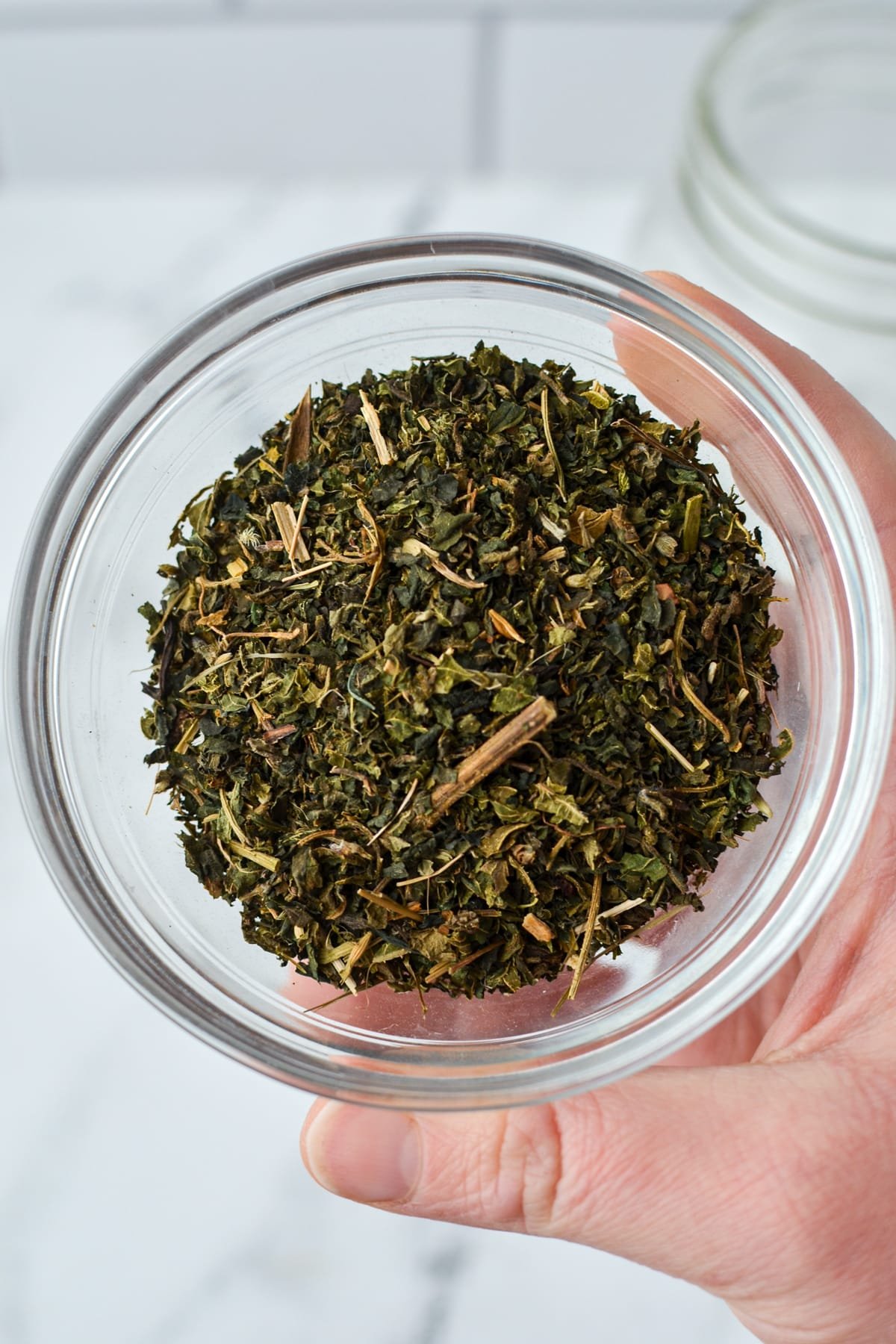 A small bowl filled with nettle leaf.