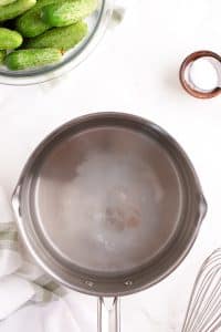 A saucepan filled with vinegar, water, and salt to make a brine for pickles.