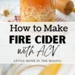 A large mason jar filled with apple cider vinegar, horseradish, ginger, and garlic.