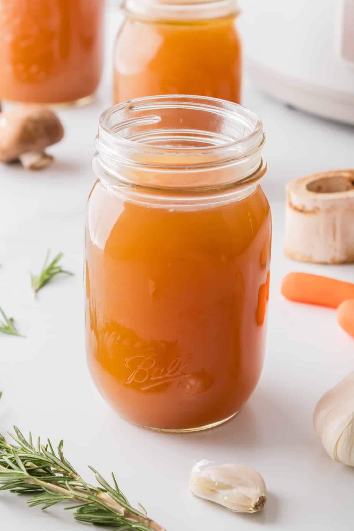 A mason jar filled with homemade beef broth.