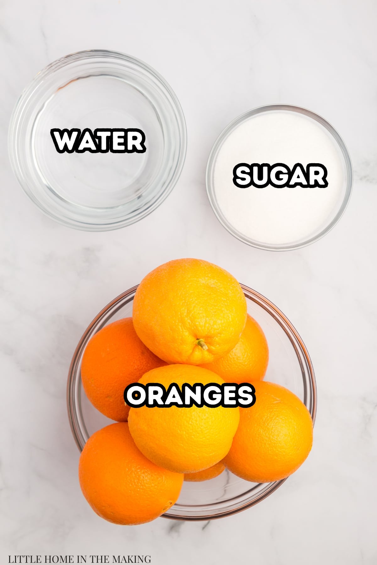 The ingredients needed to make home canned oranges: water, sugar, and oranges.