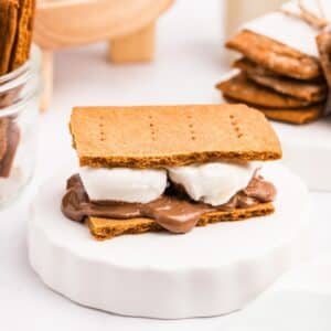 A s'more featuring sourdough graham crackers, melted chocolate, and toasted marshmallow.