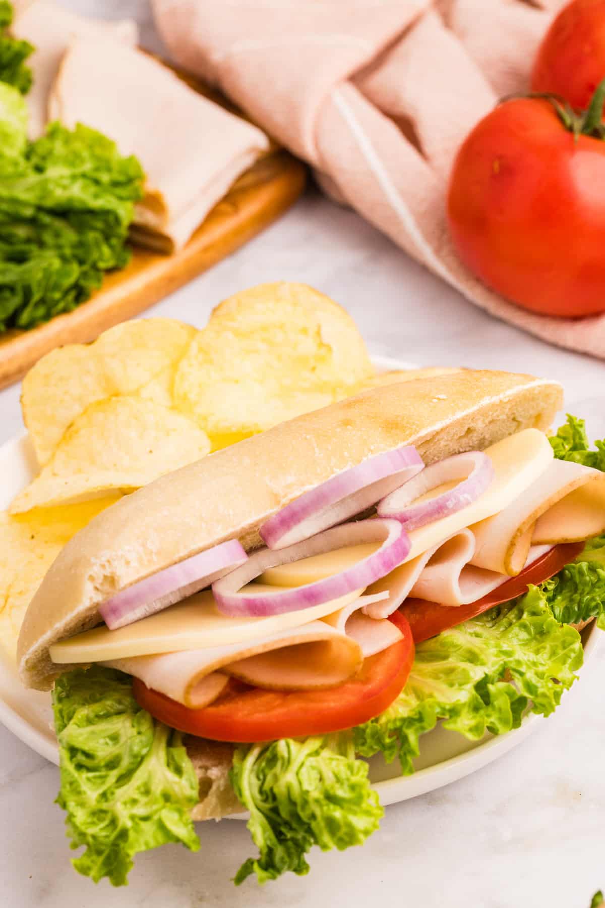 A sandwich made on a homemade sandwich roll.
