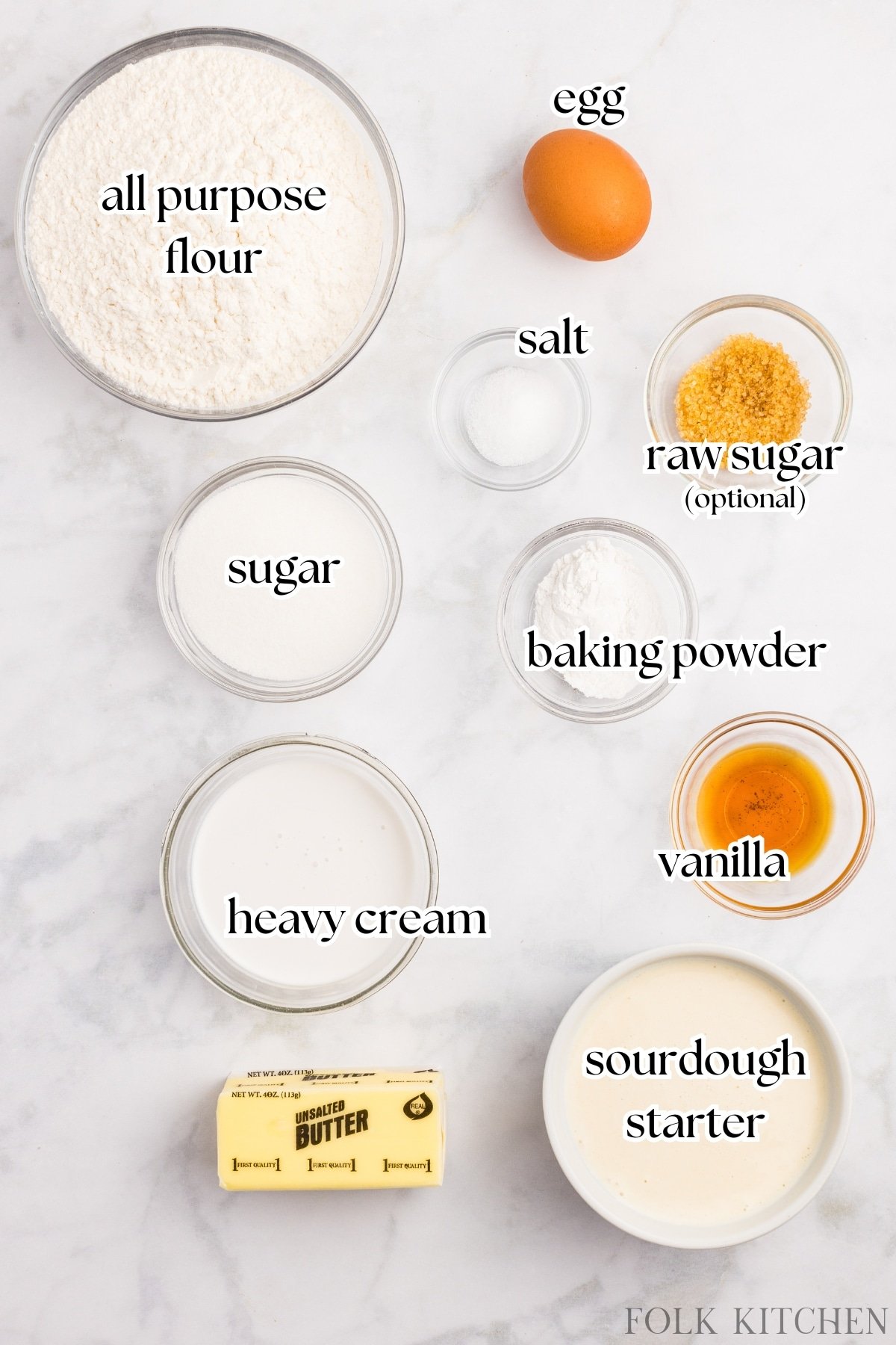 The ingredients needed to make sourdough scones, including starter, flour, butter, and heavy cream.