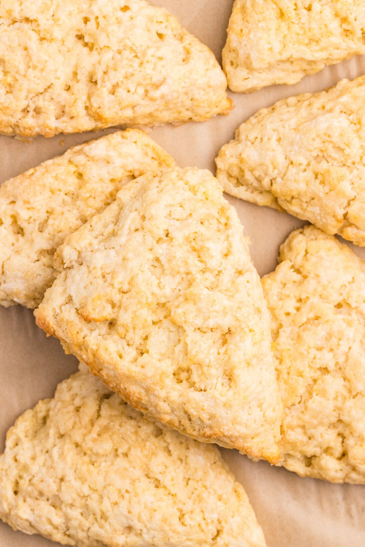 Scones laying on top of each other in a small pile.