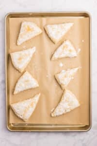 Triangles of dough brushed with heavy cream and sprinkled with sugar.