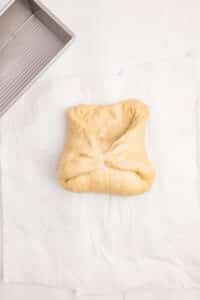 Rolling up the dough into a loaf.