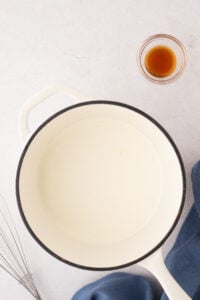 A small saucepan filled with a milky mixture.