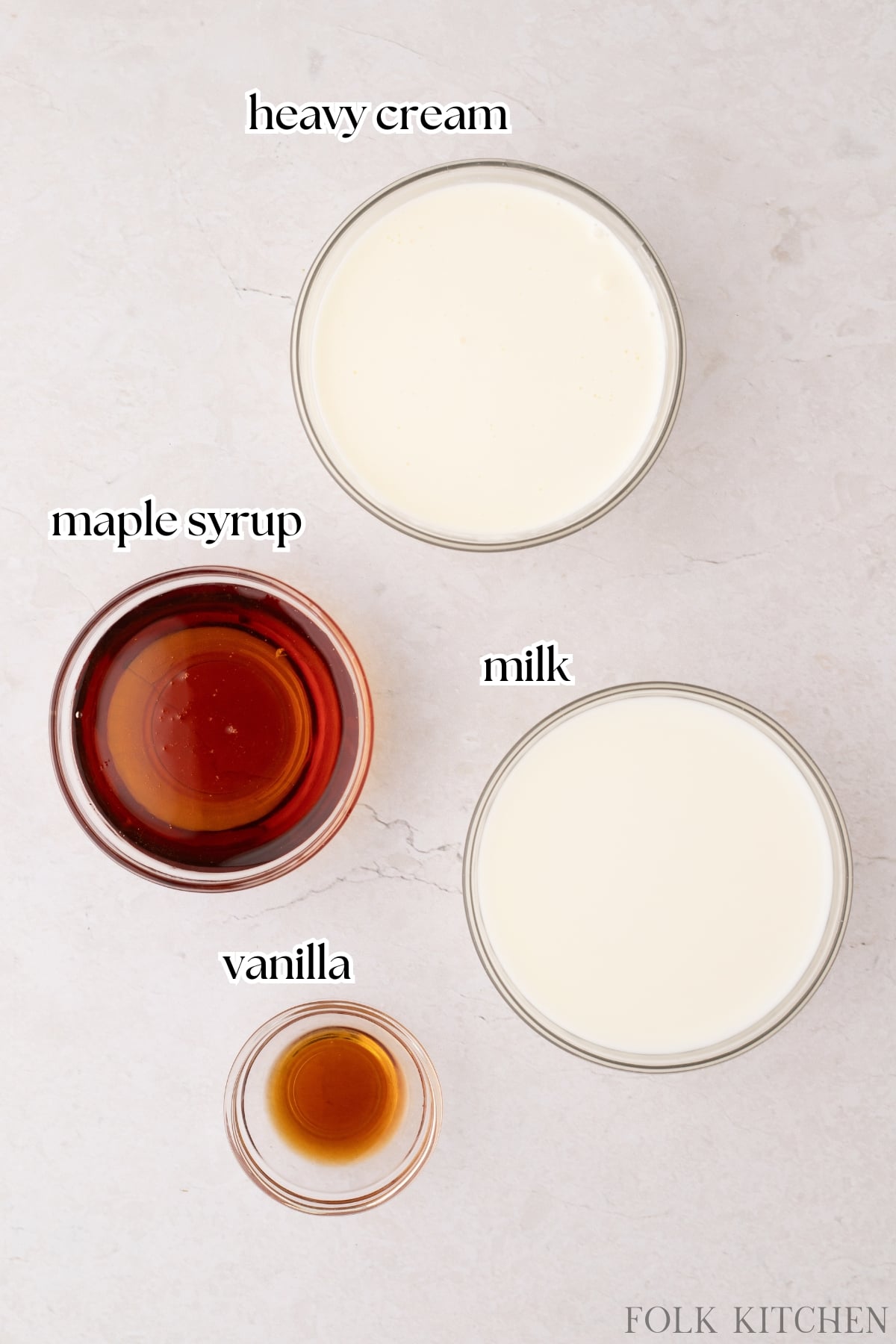 The ingredients needed to make homemade coffee creamer, including heavy cream, milk, and maple syrup.